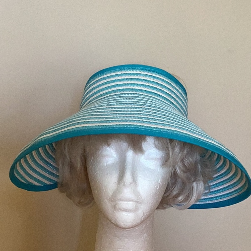 Nicole Marciano 100% straw visor with velcro closing for adjustable fit.